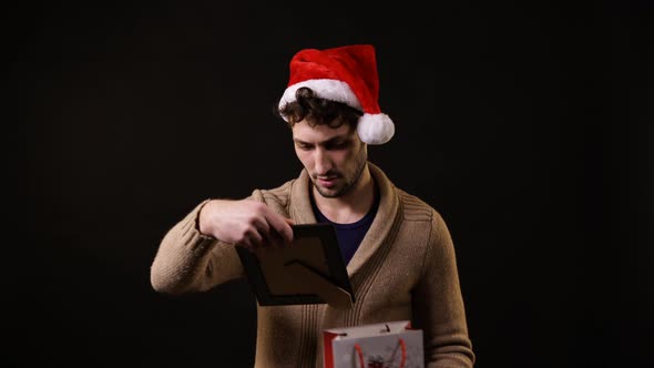 A man opening a present