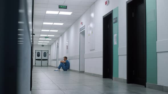 Medicine Worker Sitting Floor Ambulance Hallway