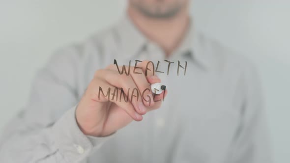 Wealth Management Writing on Screen with Hand