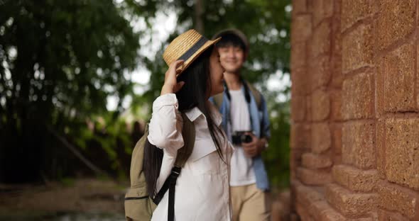 Couple hand together while visiting at ancient temple