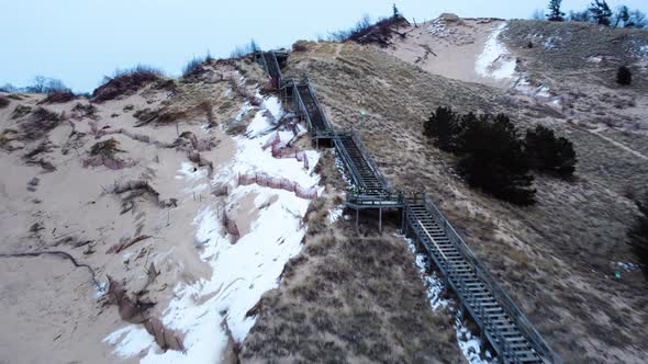 4K Drone of stairway in a sand dune on the lake shore of l