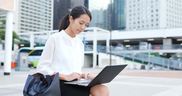 Businesswoman use of laptop computer at outdoor
