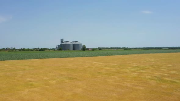 Modern Grain Silos At The Field Of Golden Wheat 13