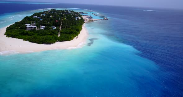 Tropical Flying Travel Shot of A White Sand Paradise Beach and Blue Water Background