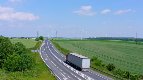 Cargo Truck On Background Of Wind Farm