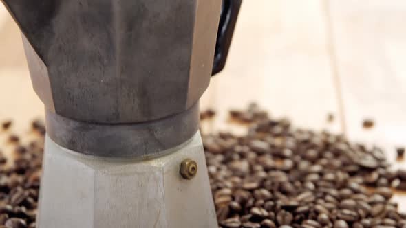 Coffee beans with metallic coffeemaker