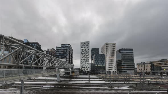 Akrobaten Bru - Acrobat Bridge Over Railroad Tracks With Futuristic Building In Background From Barc