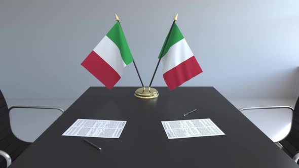 Flags of Italy and Papers on the Table