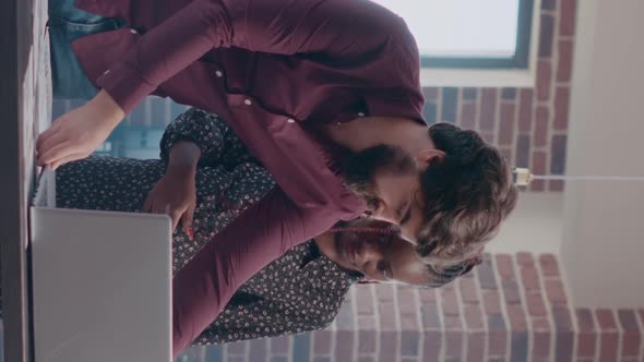 Vertical Video Pregnant Person and Man Analyzing Business Papers with on Desk