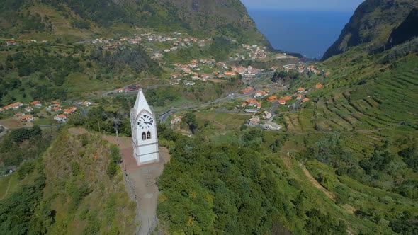 Beautiful Old Clock Tower on a Hill in Madeira with the Valley in the Distance