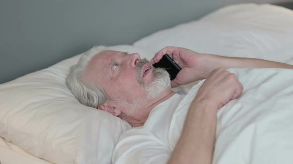 Phone Talk By Old Man Laying in Bed Discussion