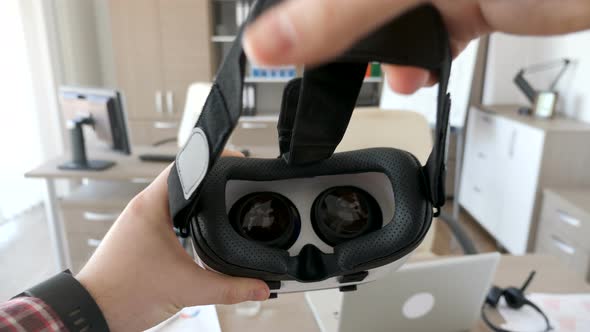 Man Hands Put a Virtual Reality Headset on