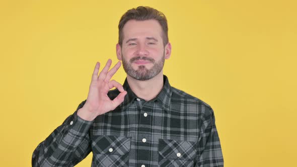 Portrait of Middle Aged Man Showing Ok Sign with Finger