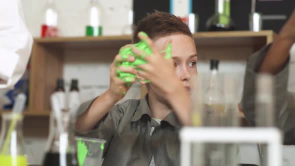 Laboratory Experience in a Chemistry Lesson, the Boy Playing with a Light Green Slime, Children's