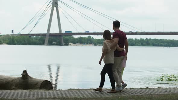 Family With Kid Looking at Bridge, Concept of Immigration or Moving to New City