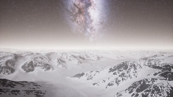 Milky Way Above Snow Covered Terrain alt