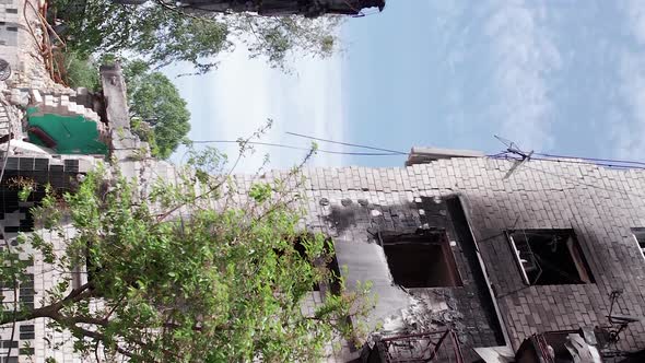Vertical Video of the Consequences of the War in Ukraine  Burned Cars