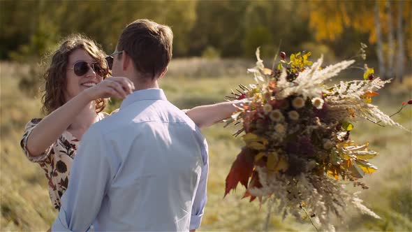 Happy Teenage Couple First Kiss Girl Kissing. Loving Couple Embracing.