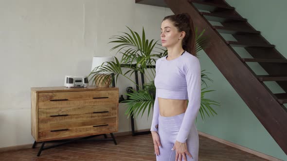 Young Woman Doing Gymnastics at Home