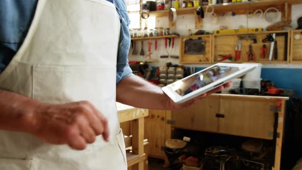 Carpenter using his tablet