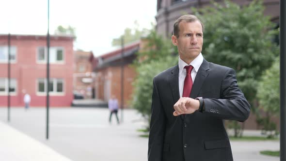 Waiting Businessman Watching Time on Smartwatch