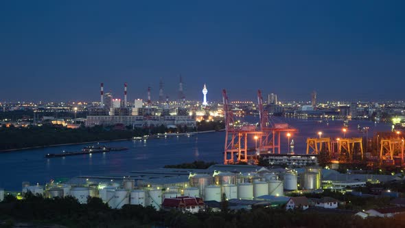 Time lapse of aerial view of Samut Prakan Observation Tower and industry factory, river,