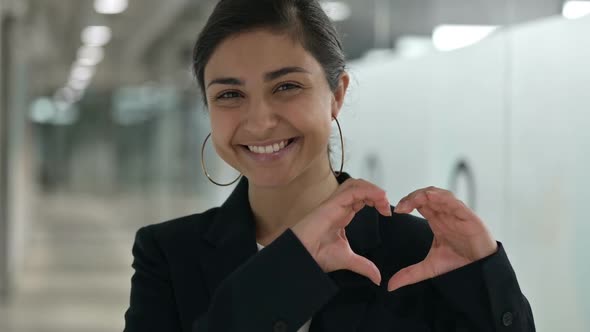 Portrait of Young Indian Businesswoman Showing Heart Sign with Hand