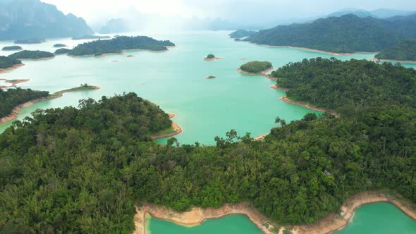 An aerial view from a drone flying over a dam, beautiful turquoise water