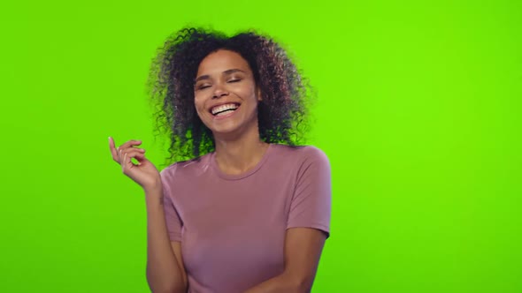 Black Woman Showing Her White Teeth To Camera While Feeling Happy on Chroma Key