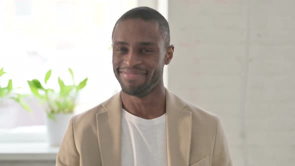 Portrait of African Man Shaking Head As Yes Sign Approval