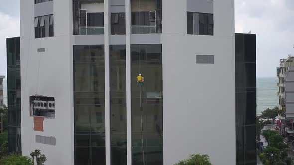 Window washer on high rise building