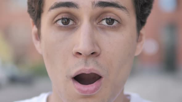 Outdoor Close up of Shocked Young Man