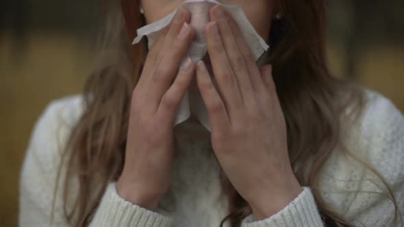 Girl Suffering from Runny Nose and Teardrop Discharge, Symptom of Seasonal Virus