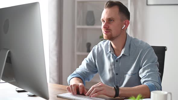 A Young Man Is Working with a PC in the Office