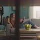 Young Woman Eats a Red Apple Lying on Sofa and and Watching Something Gadget - VideoHive Item for Sale
