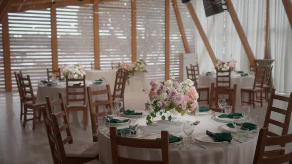 Very Beautiful Decor of the Wedding Hall with Fresh Flowers in Delicate Tones