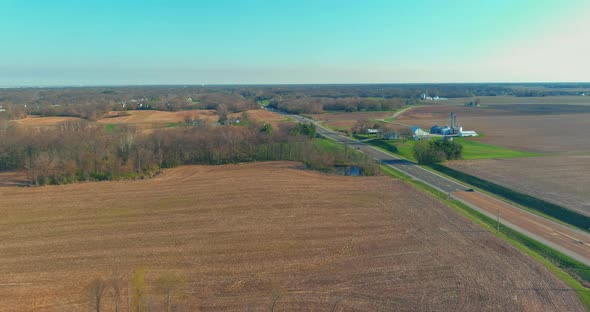 View of an Country Asphalt Road Through Agricultural Fields in the Caseyville Illinois on USA