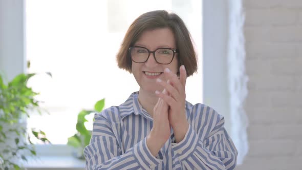 Portrait of Happy Senior Woman Clapping Applauding