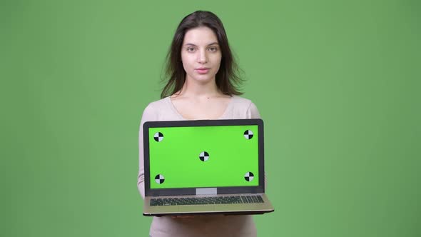 Young Beautiful Woman Showing Laptop