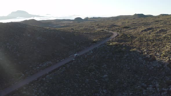 Aerial view of a car driving a serpentine road, Reunion.