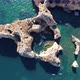 Drone shot of kayaks and boats passing in the ocean, people exploring caves and tunnels. - VideoHive Item for Sale