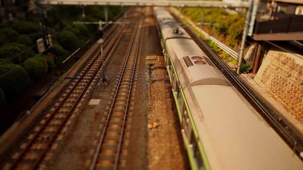 Looking down at trains going by in Tokyo Japan