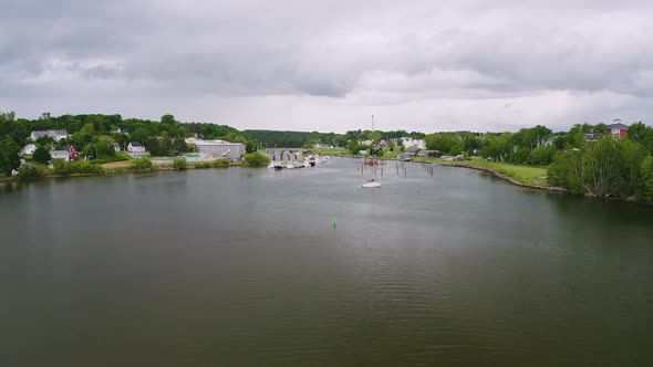 Montague, Prince Edward Island on a cloudy summer day. Drone aerial view. Camera rises from the wate
