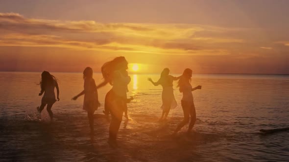 A Group of Five Young Teenager Friends Travel to the Beach Looking at the Sea