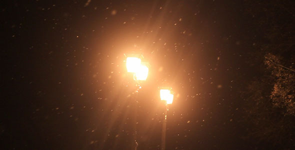 Old Street Light and Falling Snow