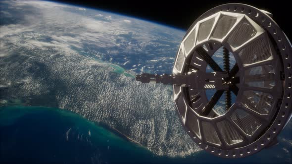 Futuristic Space Satellite Orbiting the Earth alt