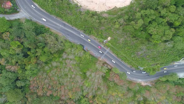 Aerial view of mountain road in forest in autumn season Top view