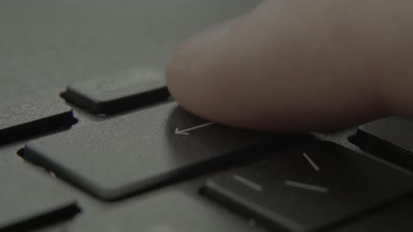 The Finger Presses the Backspace Button on the Keyboard