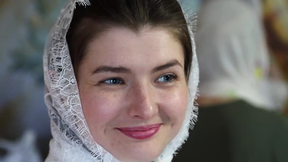 Portrait of a Beautiful Young Woman Looking Straight at the Camera and Smiling