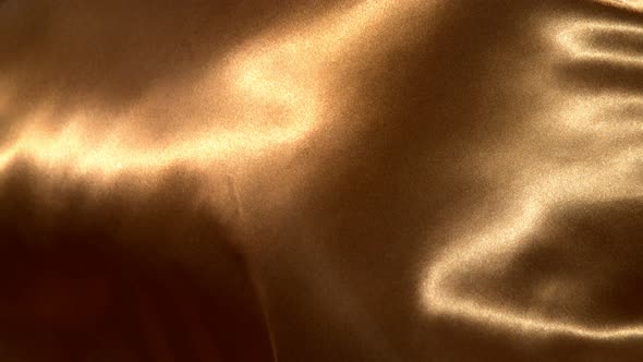 Golden Wavy Fabric Background in Super Slow Motion